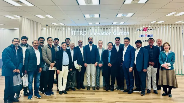 An AFGED delegation gathered for a group photograph at an international business event