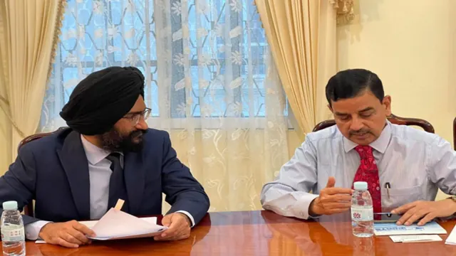Representatives discussing international business at a meeting table